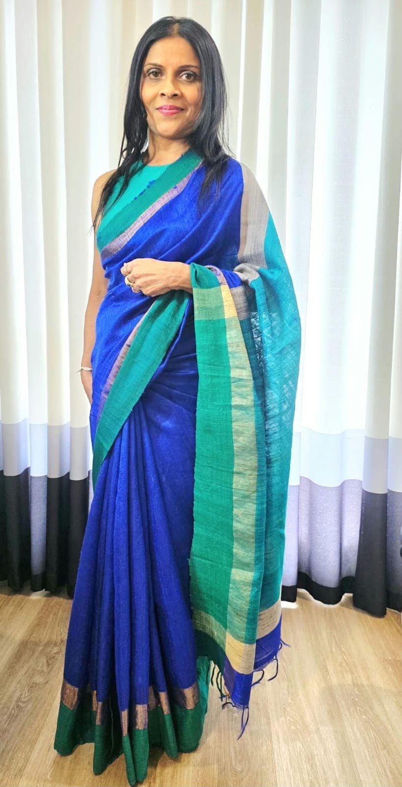 Special-occasion makeup and styling with a blue and green silk saree